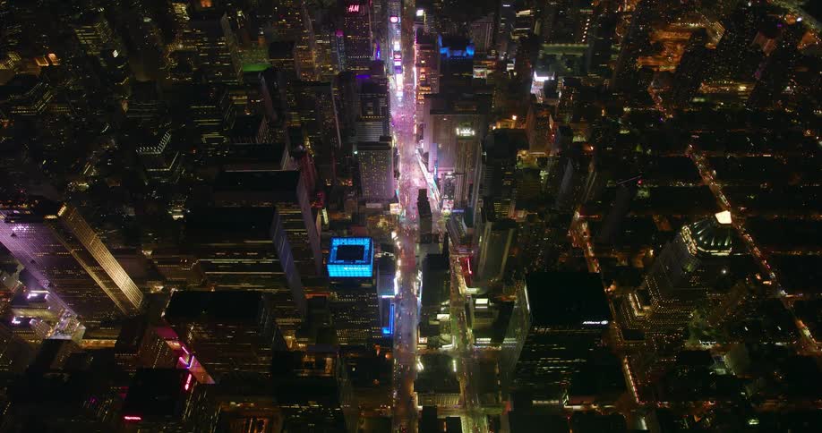 City buildings and street lights illuminate the city at night