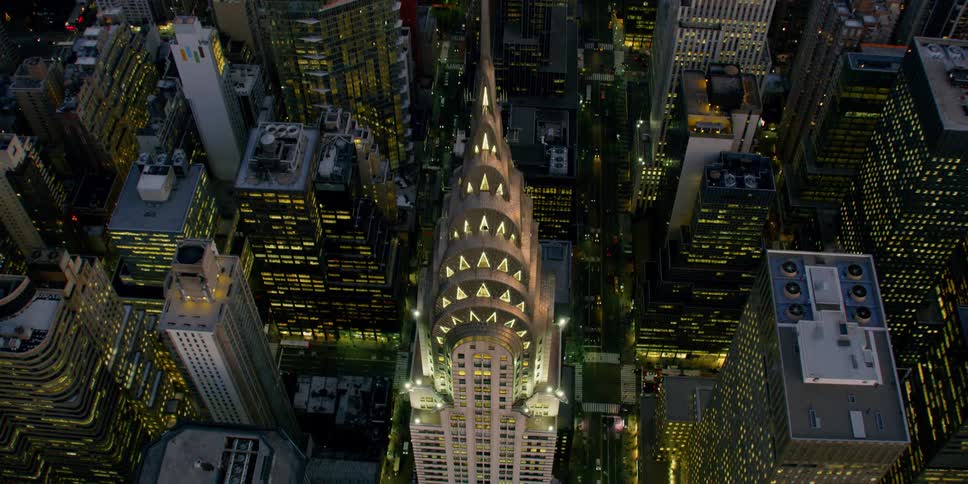 The empire state building looms over manhattan at dusk