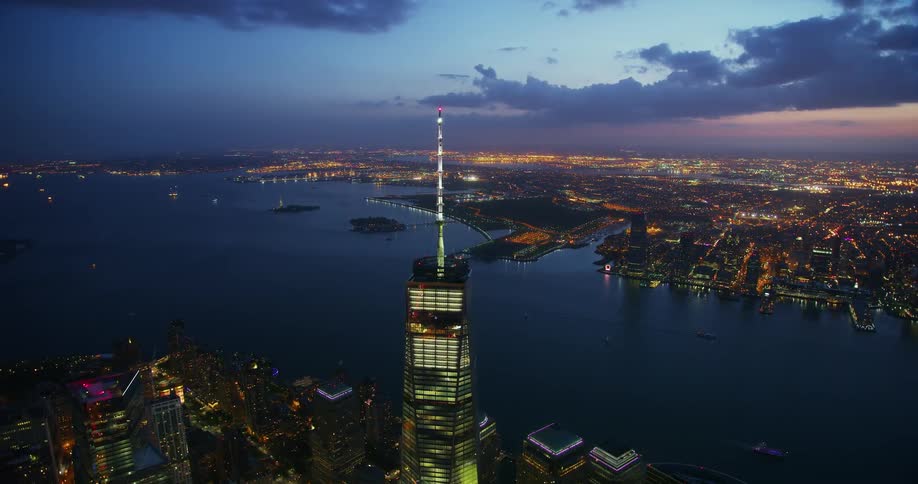 A tower in the city illuminates at night