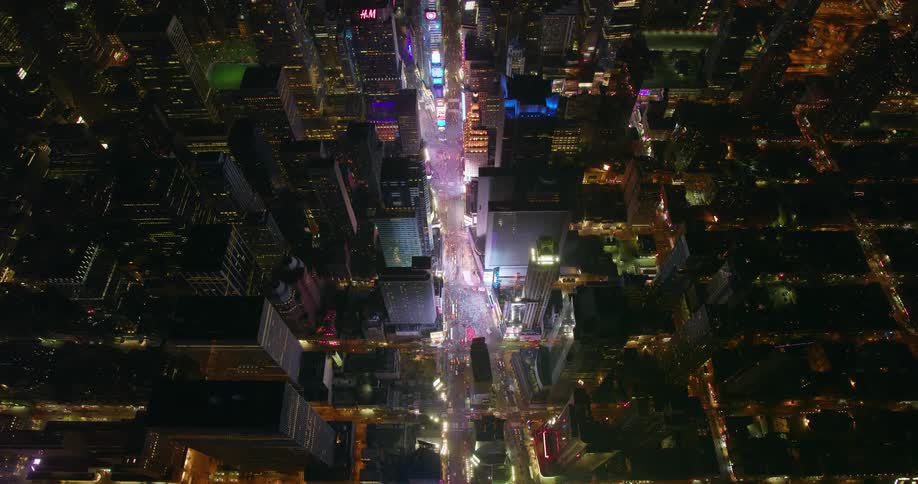 City buildings and street lights illuminate the city at night