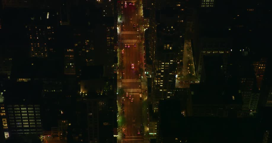 A busy city street at night