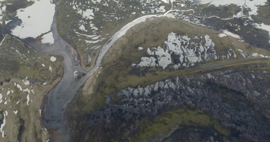 Water flows between a frozen landscape