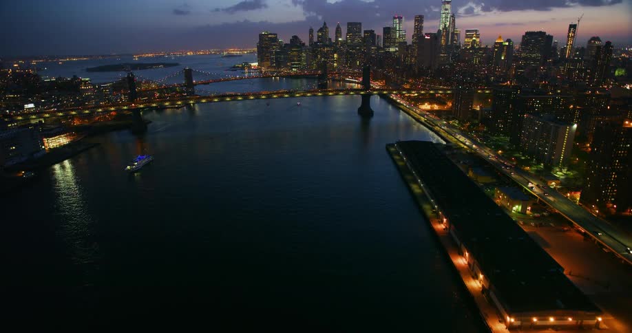 Vehicles travel on a bridge at night