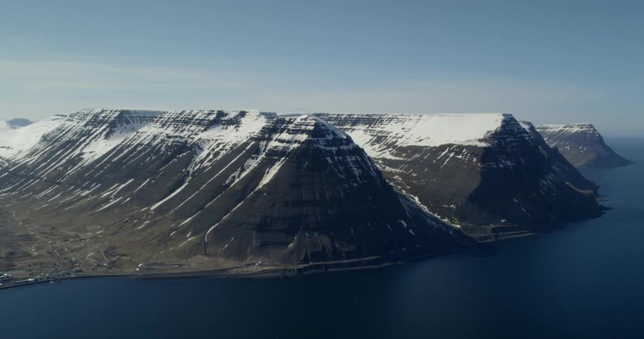 Ocean meets snow covered mountains