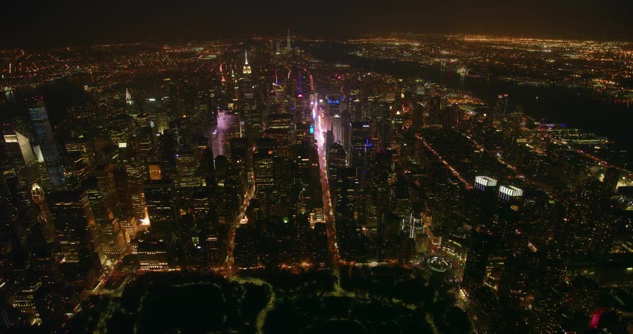 City buildings and street lights illuminate the city at night