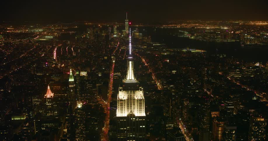 The empire state building and city skyline at night