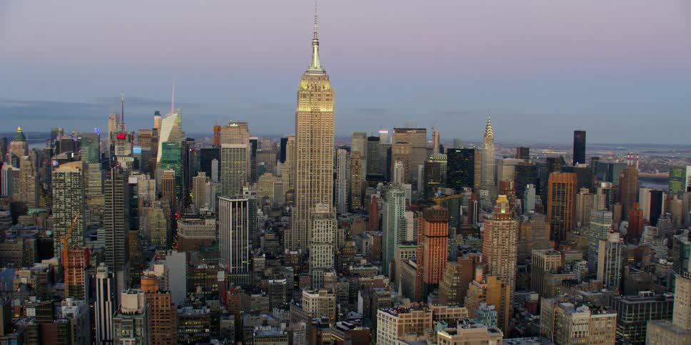 Aerial view of a large city at sunset