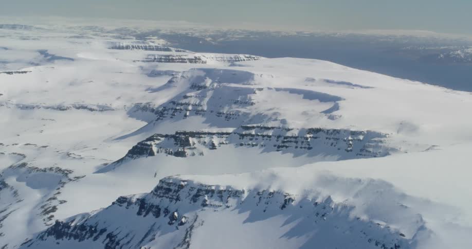 Snow and ice cover the mountains