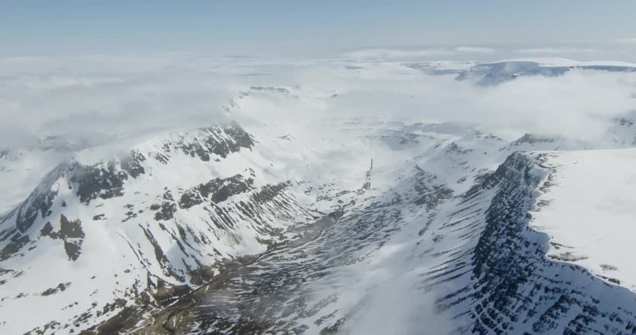 Snow and ice cover the mountains