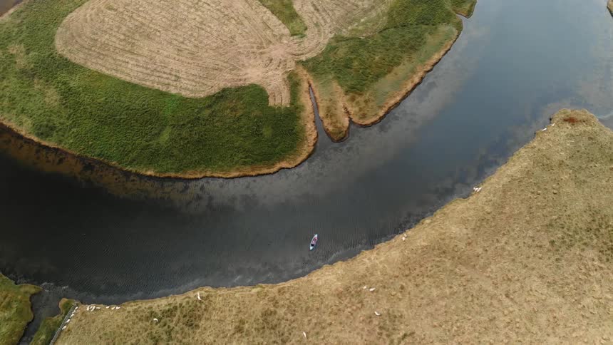 A kayak floats on a river