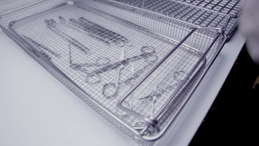 A medical professional packs up medical instruments