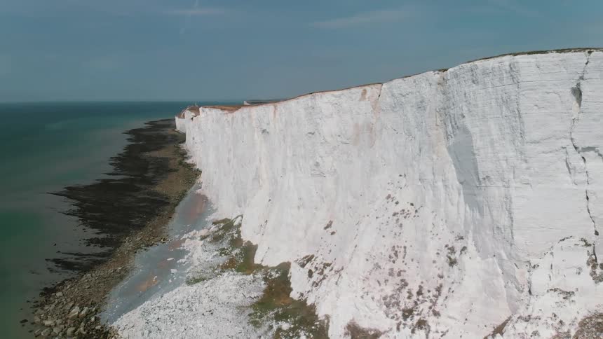 White rock cliffs line the coast