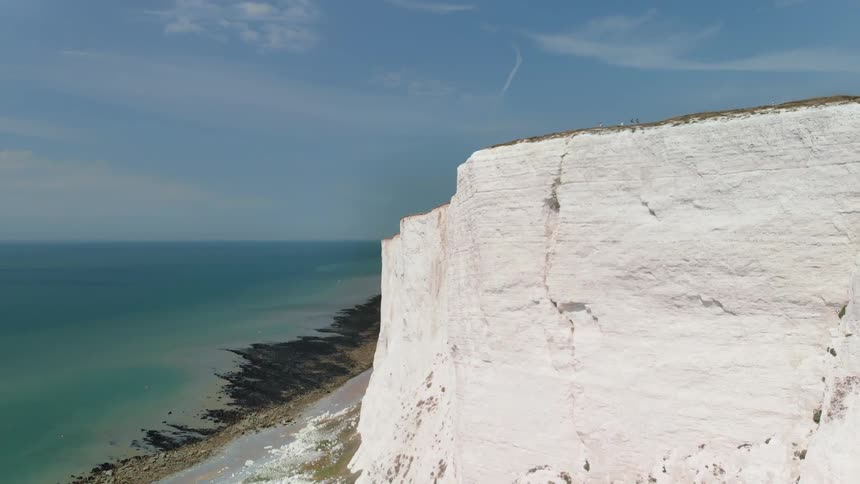 A rocky cliff stands on the coast