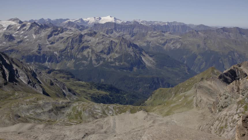 Looking out over a huge valley with mountains in the distance