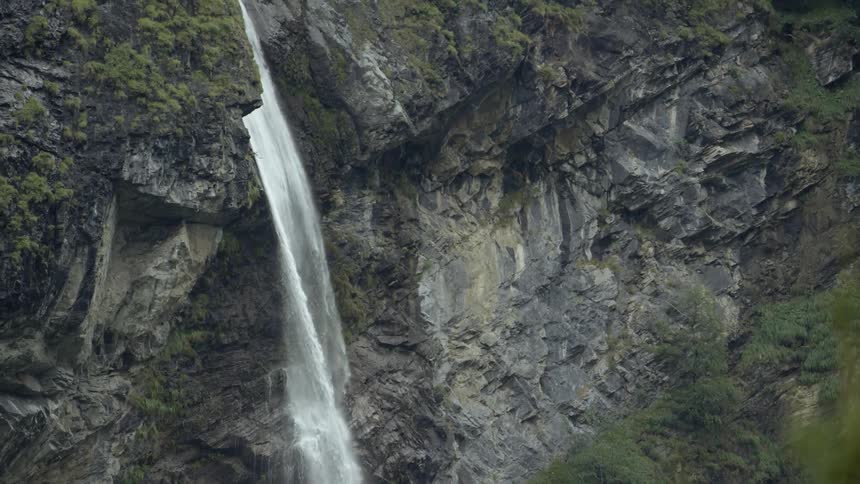 Aerial view of a waterfall flowing from up high