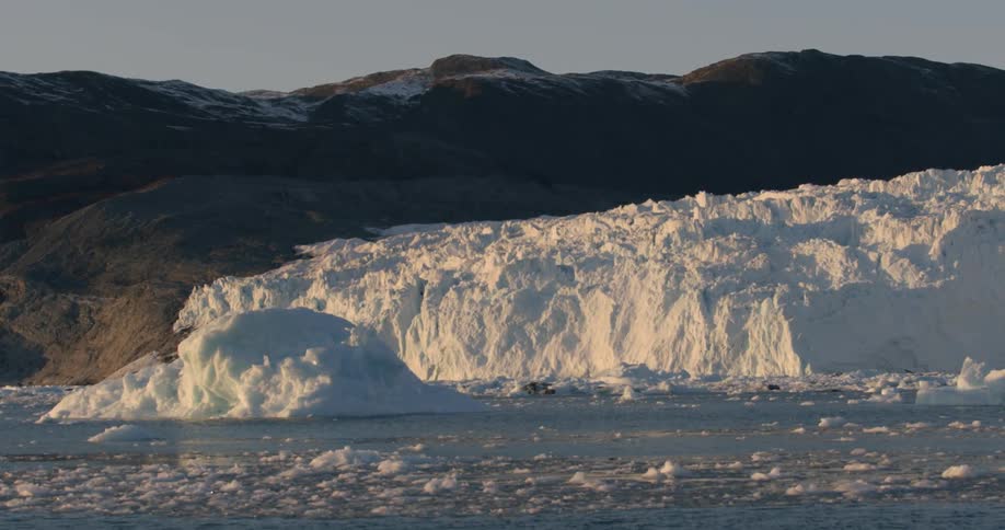 A glacier at the base of a mountain