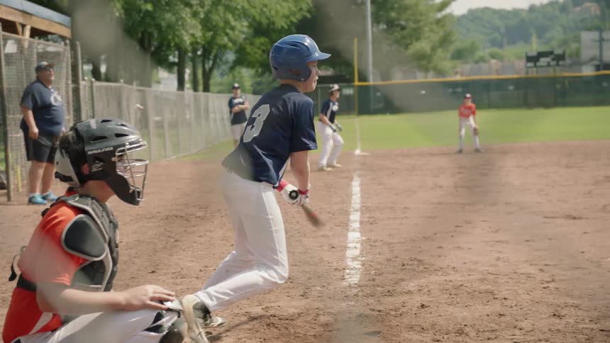 Batter connects with the baseball
