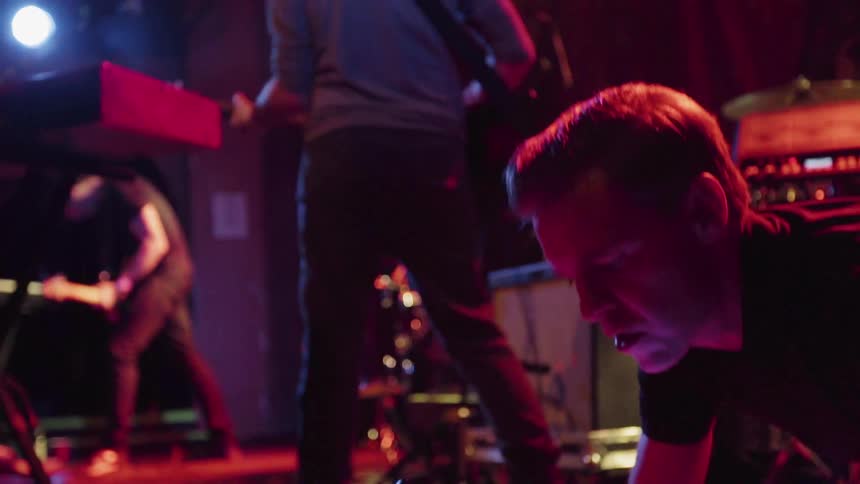 A band plays music on stage