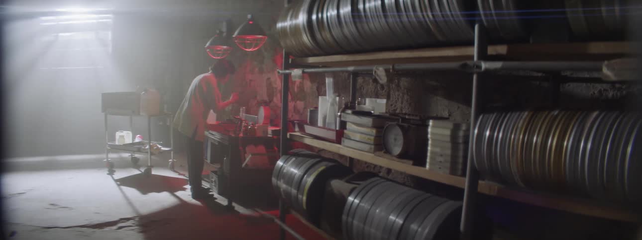 Woman works in a film storage warehouse