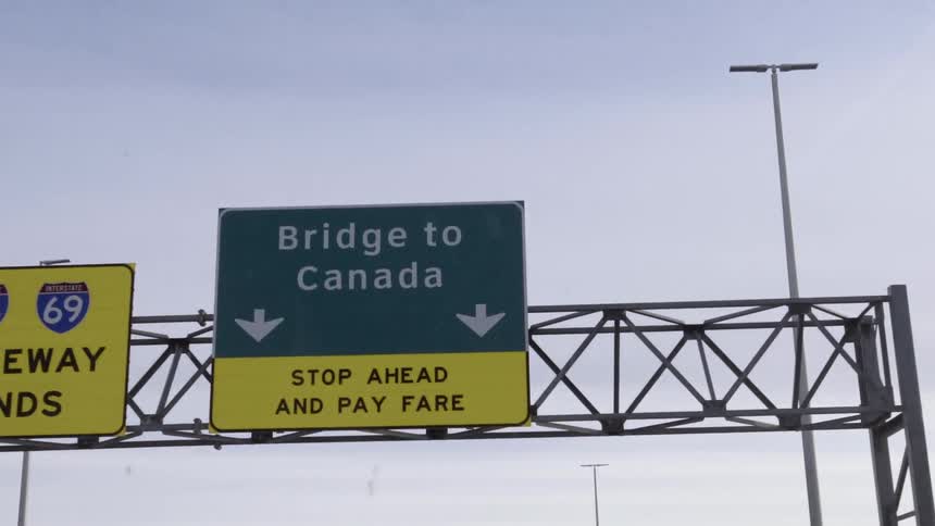A freeway sign that says bridge to canada