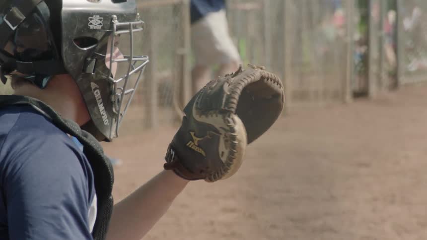 A catcher in baseball is waiting for the pitch