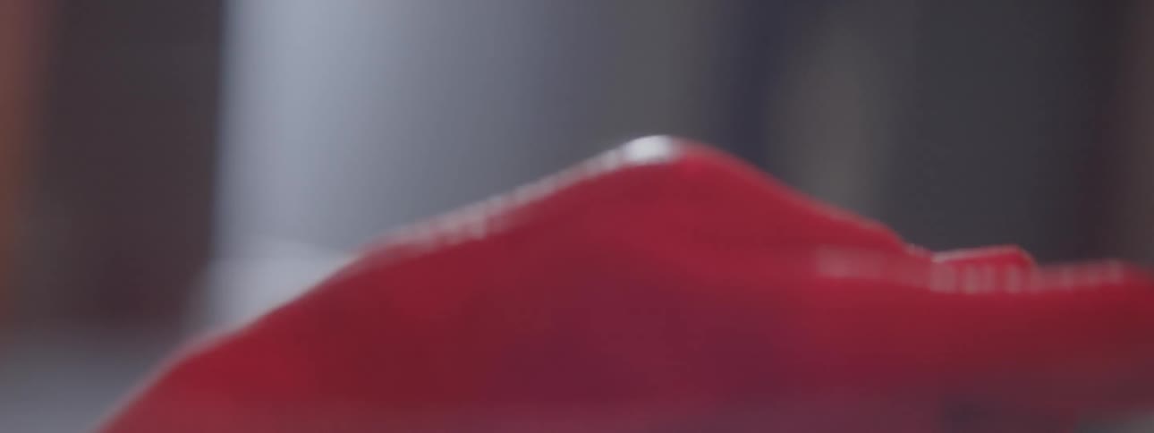 A person is looking through a film reel