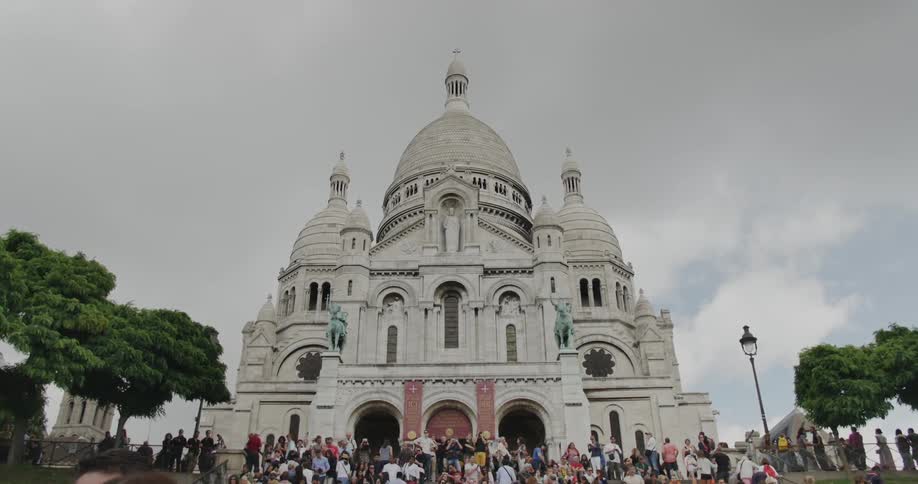 People stand in front of a domed building
