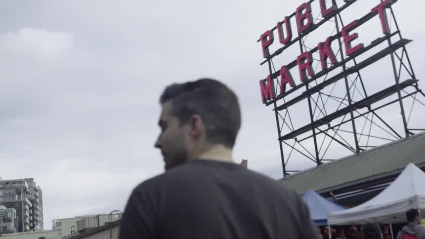 Man walks through an outdoor market