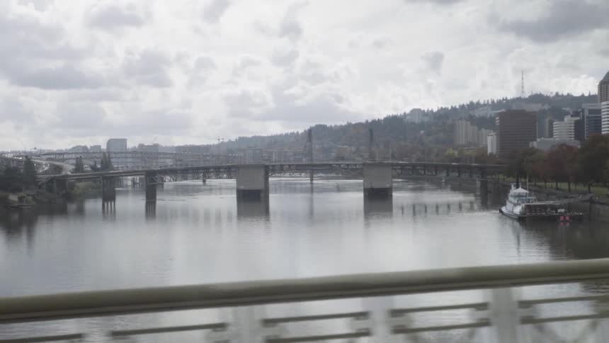 Driving across a bridge on a cloudy day