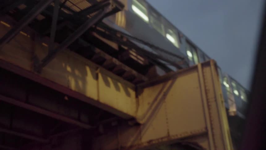 A commuter train passes on a bridge