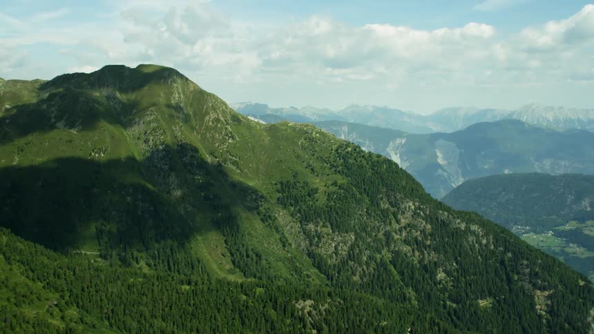 Helicopter Timelapse - Greenery covers the tall mountains