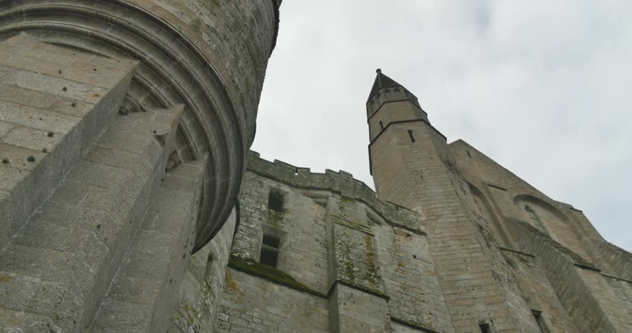 Looking up at an old castle