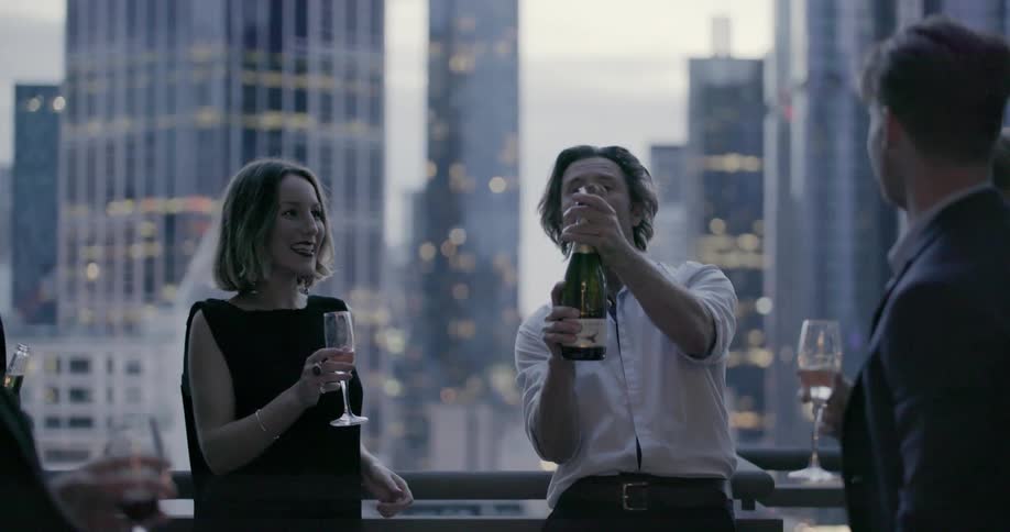A group of people celebrate with champagne