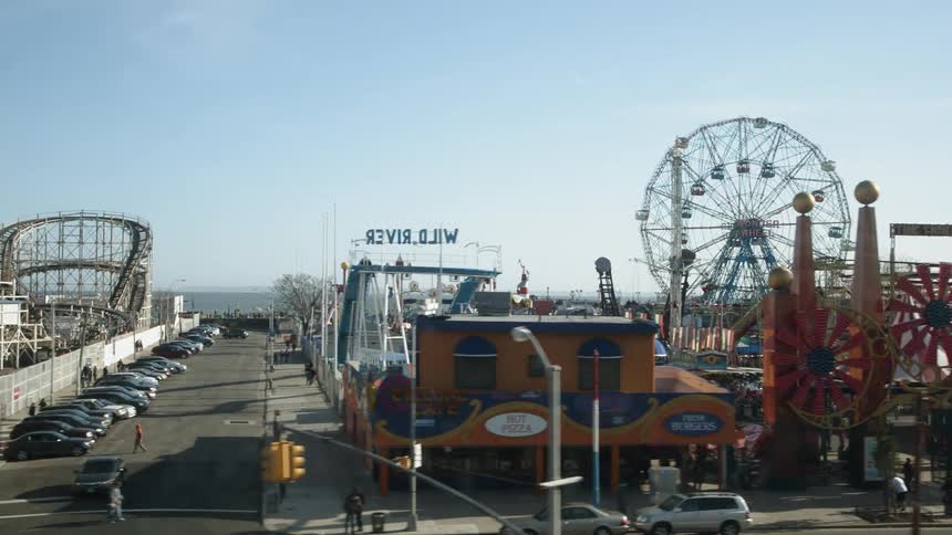 Large carnival near the ocean on sunny day