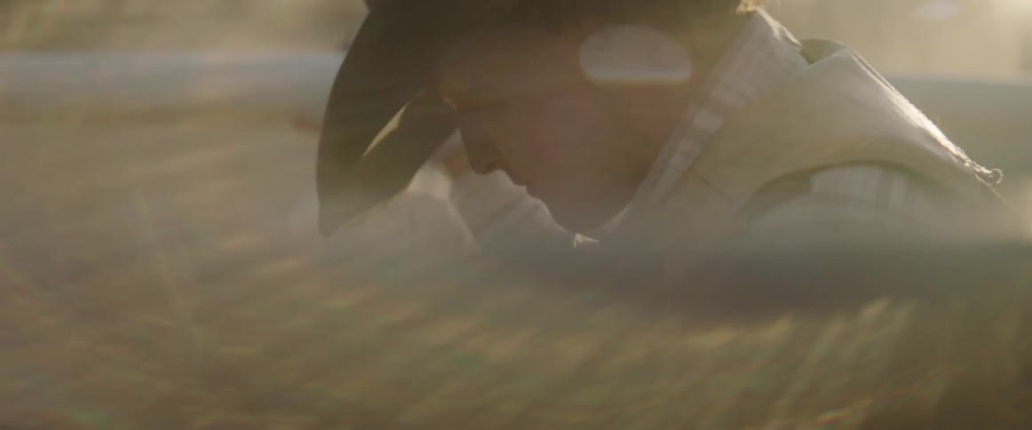 Cowboy prepares to ride a bull out of the chute