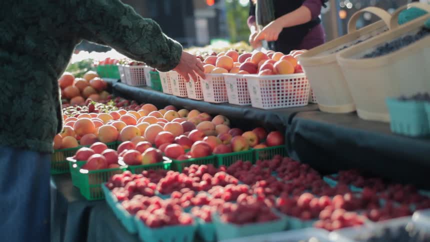 Close up of various fruits being sold at a farmers market