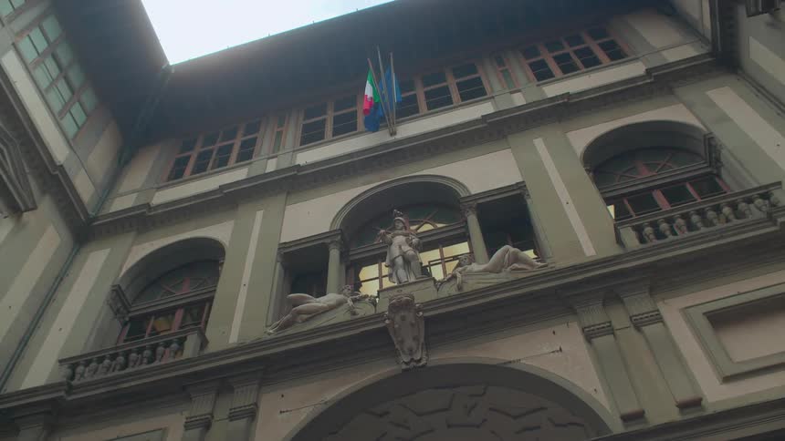 Flags hang above an ornate statue