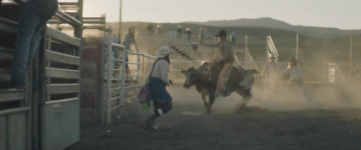 A man rides a bull in a rodeo
