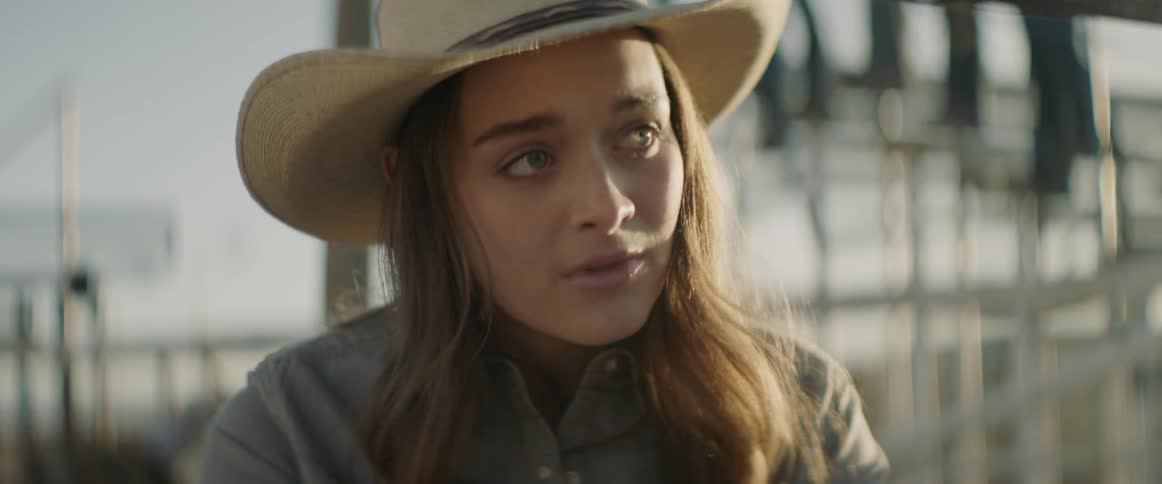 A woman wearing a cowboy hat
