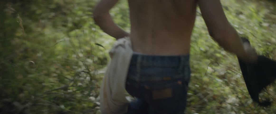 Boys walk through the woods
