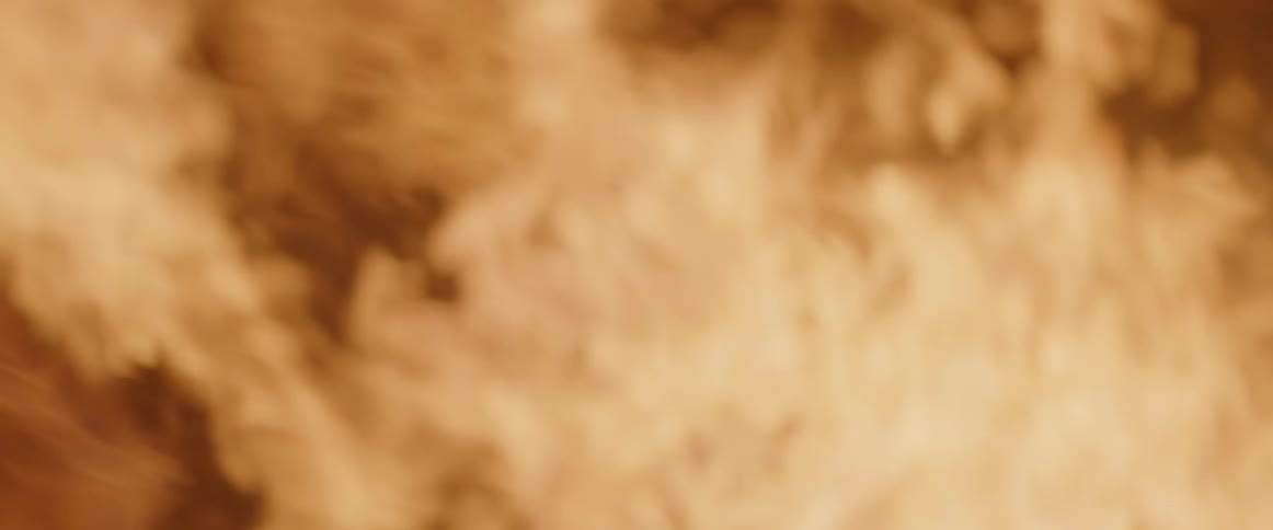 A log is placed on a flaming fire
