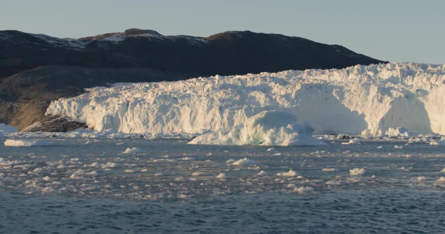 Very cold water flowing through an icy land on a clear day
