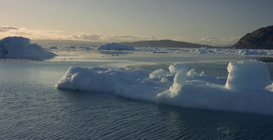 Water flows in arctic waters near icebergs