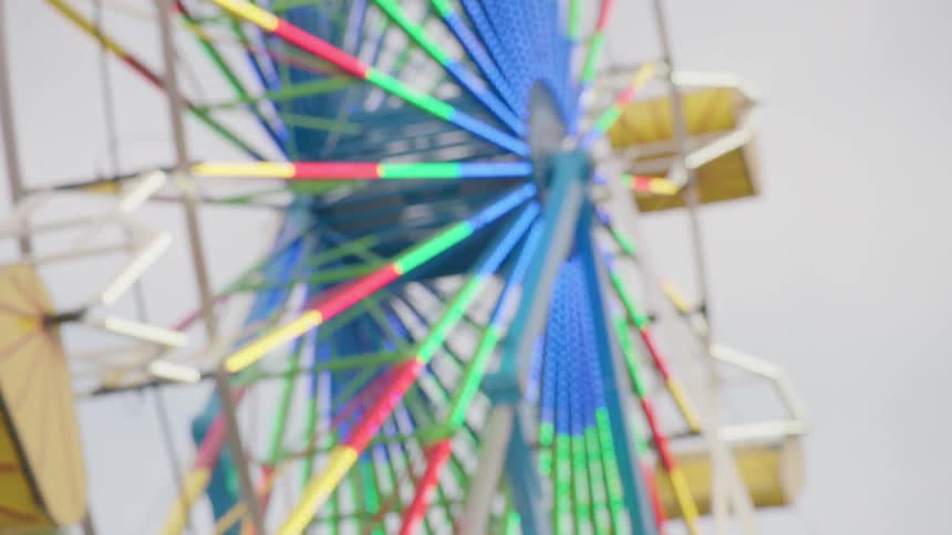 Ferris wheel is spinning at fair
