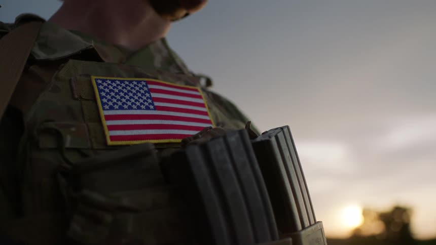 A military person wearing camo