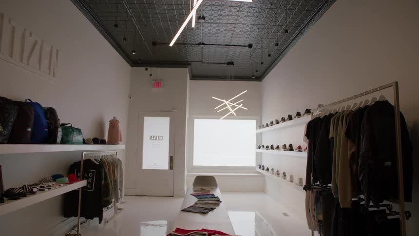 Clothes are on display in a small boutique