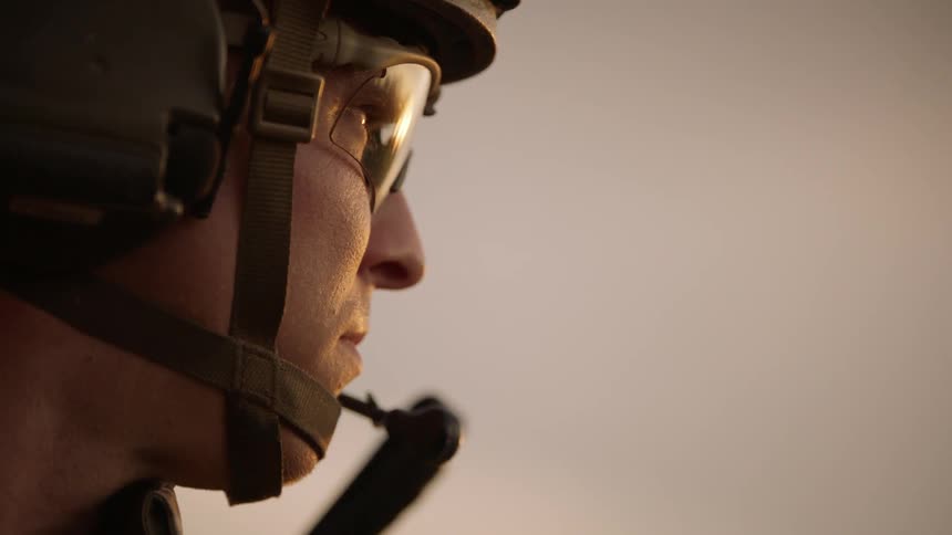 Soldier wears a helmet on his head