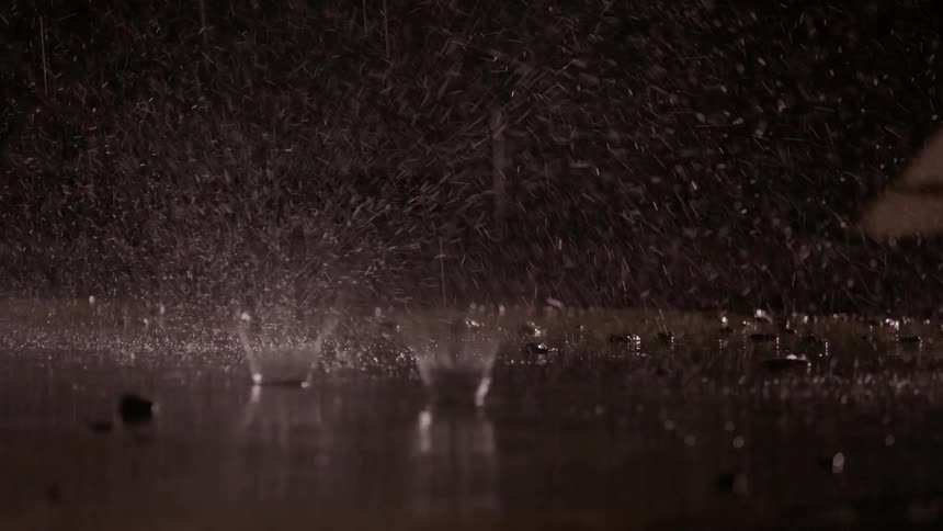 Water drops fall onto the concrete