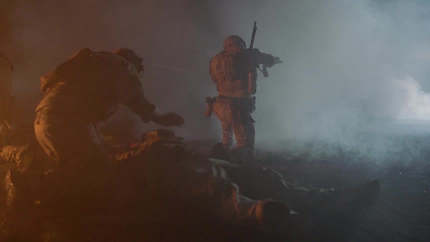 A man tries to save a downed soldier