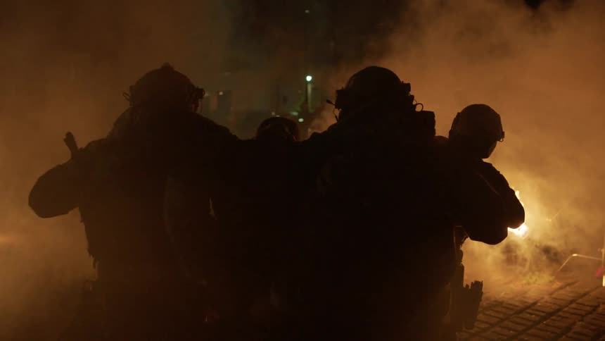 Two firefights carry a person from the flames